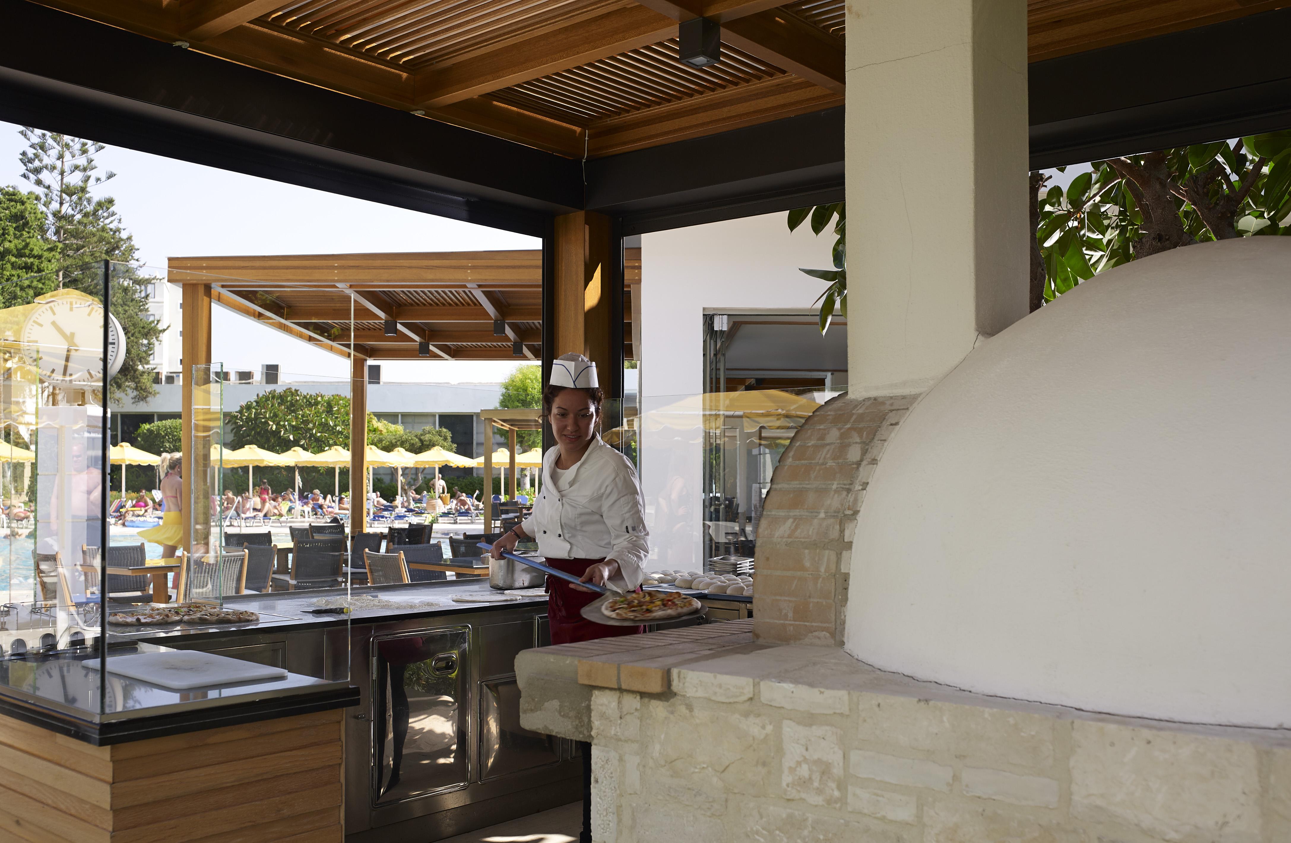 Mitsis Grand Hotel Rhodes City Exterior foto A wood-fired oven in a restaurant