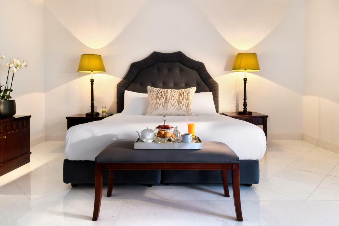 Mitsis Grand Hotel Rhodes City Exterior foto A bedroom at the hotel
