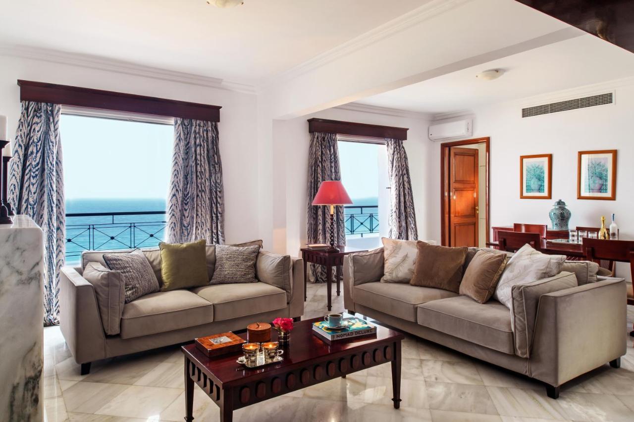 Mitsis Grand Hotel Rhodes City Exterior foto A living room in a suite at the Taj Bengal